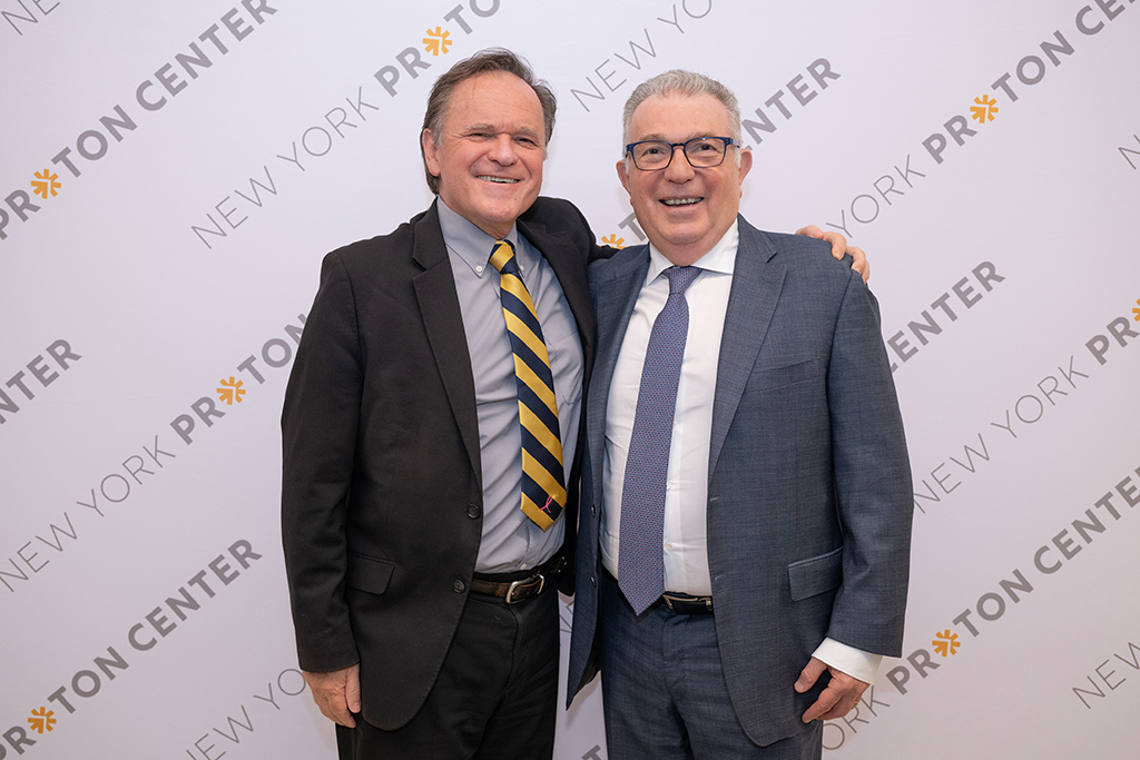 Two gentlemen pose at the New York Proton Center 5th Anniversary celebration