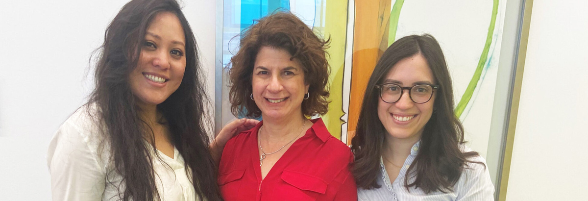 Three women celebrating Women's History Month at the New York Proton Center